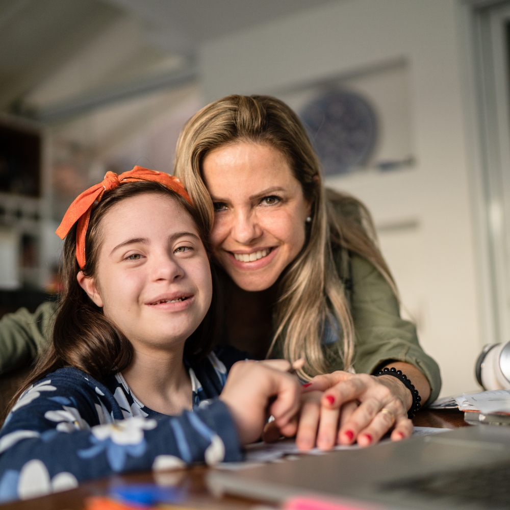Happy group of young adults with special needs celebrating together